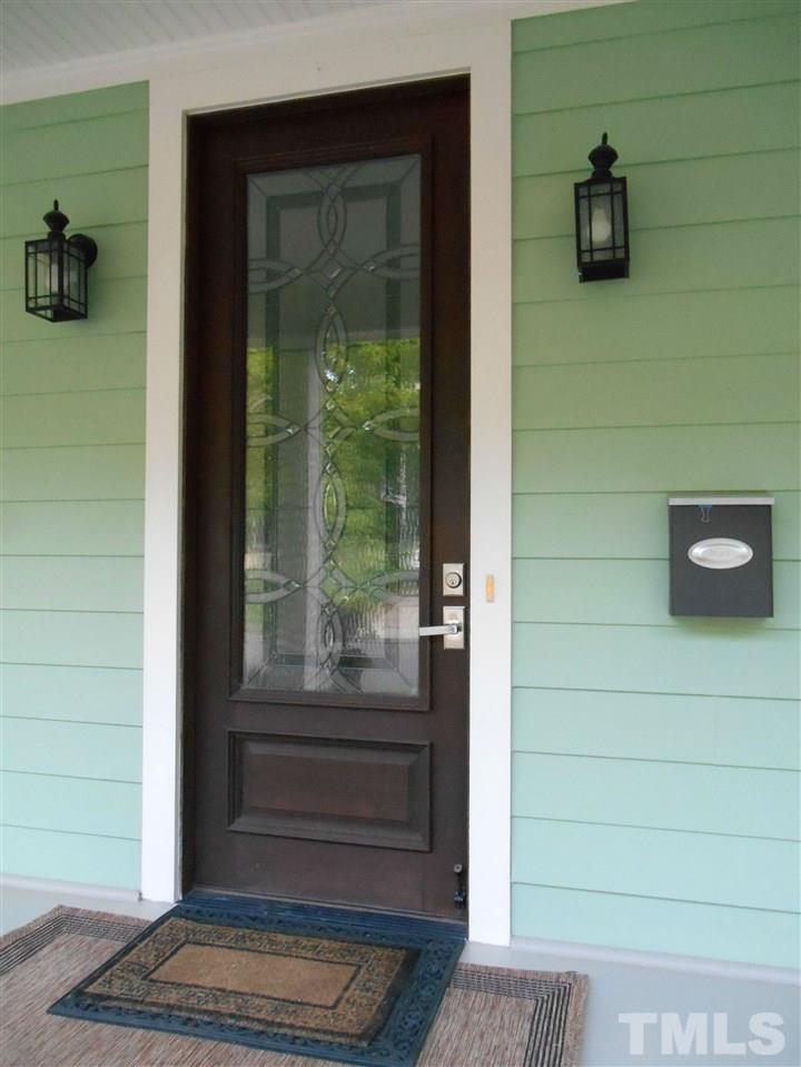 515 Euclid Street Raleigh, NC 27604 - Photo 2 of 24 As you enter, note the 8 foot door. Also, the Craftsman style window and door trim and all the cabinet doors are made from lumber from a tree that came down in the owner's yard.