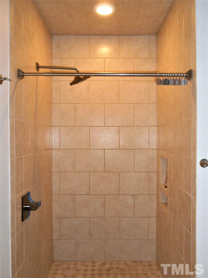 515 Euclid Street Raleigh, NC 27604 - Photo 13 of 24 Spacious shower with rainfall shower head and separate hand held shower head.