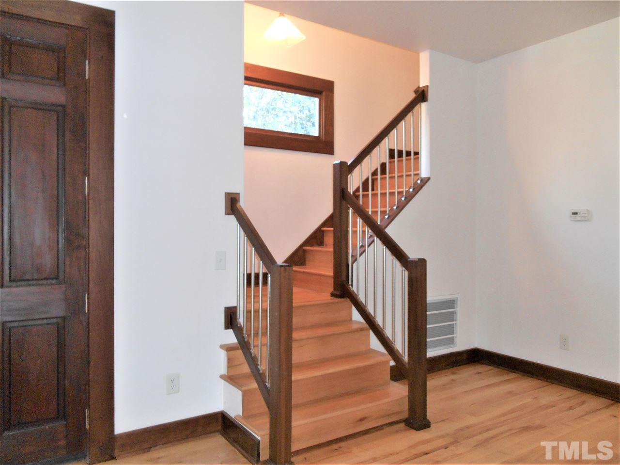 515 Euclid Street Raleigh, NC 27604 - Photo 16 of 24 Two landings, sturdy hand rails and custom window for safer traversing up and down.