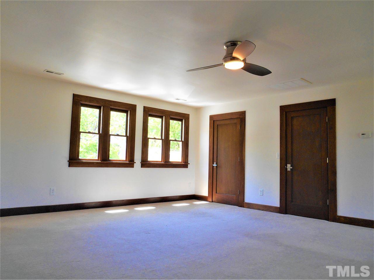 515 Euclid Street Raleigh, NC 27604 - Photo 17 of 24 This large, second master could be closed off and an exterior stair added to create a completely separate living space. Off this suite is a huge attic that is partially finished for additional living area.