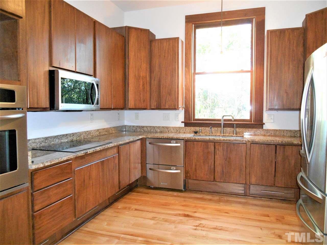 515 Euclid Street Raleigh, NC 27604 - Photo 5 of 24 Endless storage and high end appliances. Huge window brings nature in.