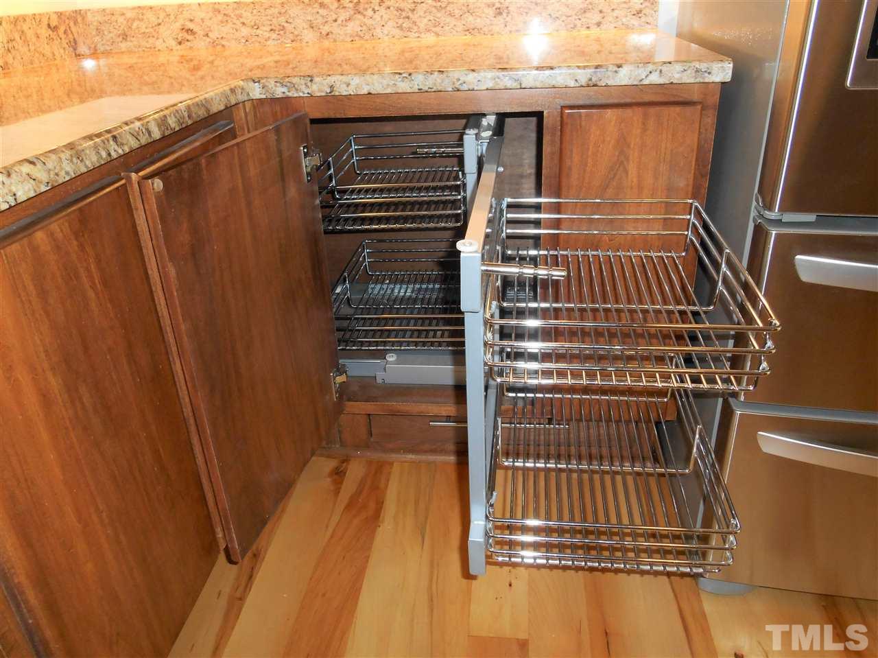 515 Euclid Street Raleigh, NC 27604 - Photo 7 of 24 Two sets of stainless racks slide into corners that are usually useless. They provide extra space for spices or other necessities.