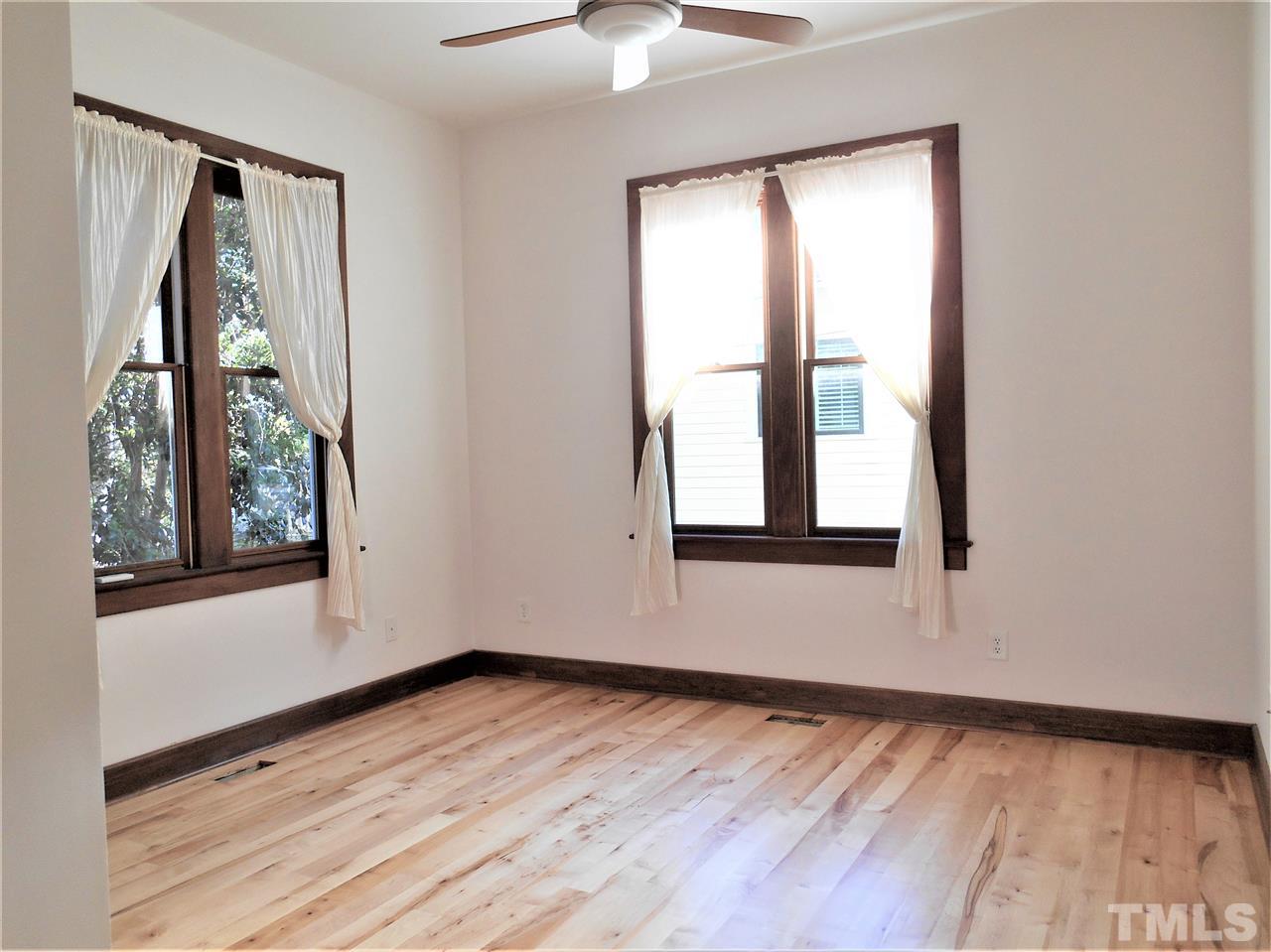 515 Euclid Street Raleigh, NC 27604 - Photo 9 of 24 This sunny bedroom also makes a convenient office.