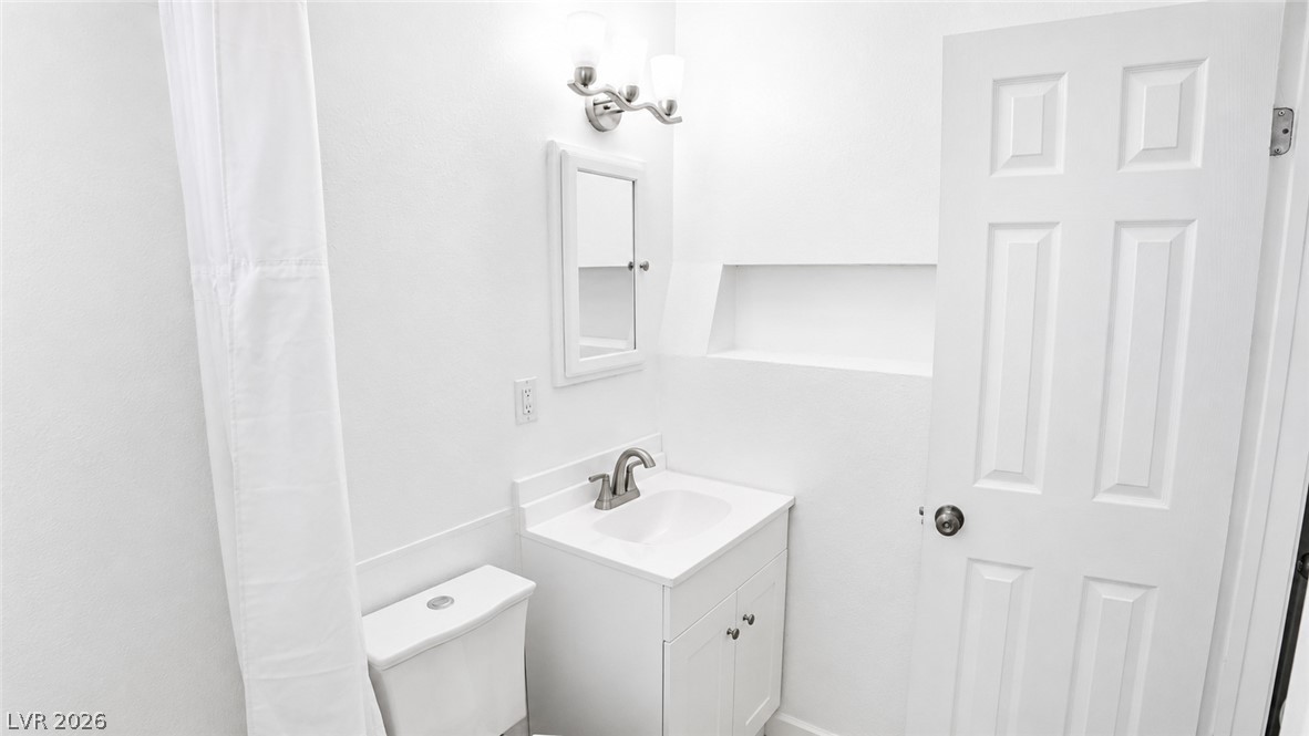 2870 South Sandhill Road Las Vegas, NV 89121 - Photo 45 of 64 A pristine bathroom features a classic vanity and contemporary fixtures, presenting a fresh appeal.