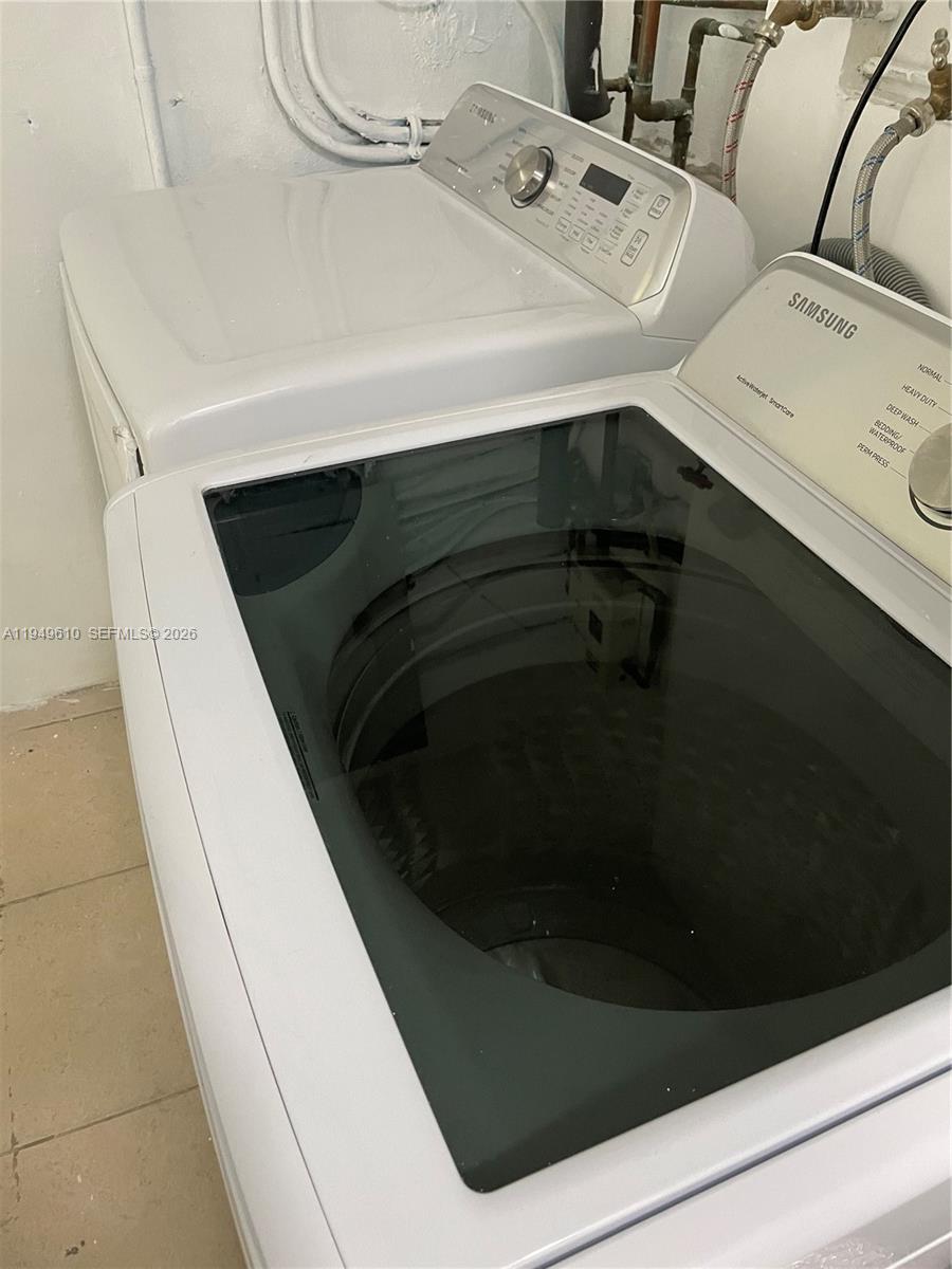 5321 Southwest 89th Court Miami, FL 33165 - Photo 2 of 4 a utility room with dryer and washer