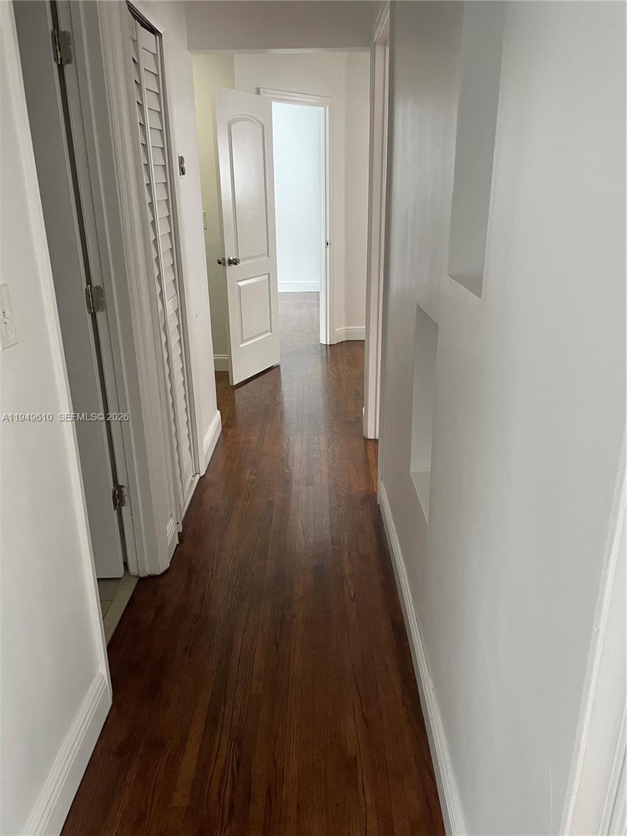5321 Southwest 89th Court Miami, FL 33165 - Photo 3 of 4 a view of a hallway with wooden floor