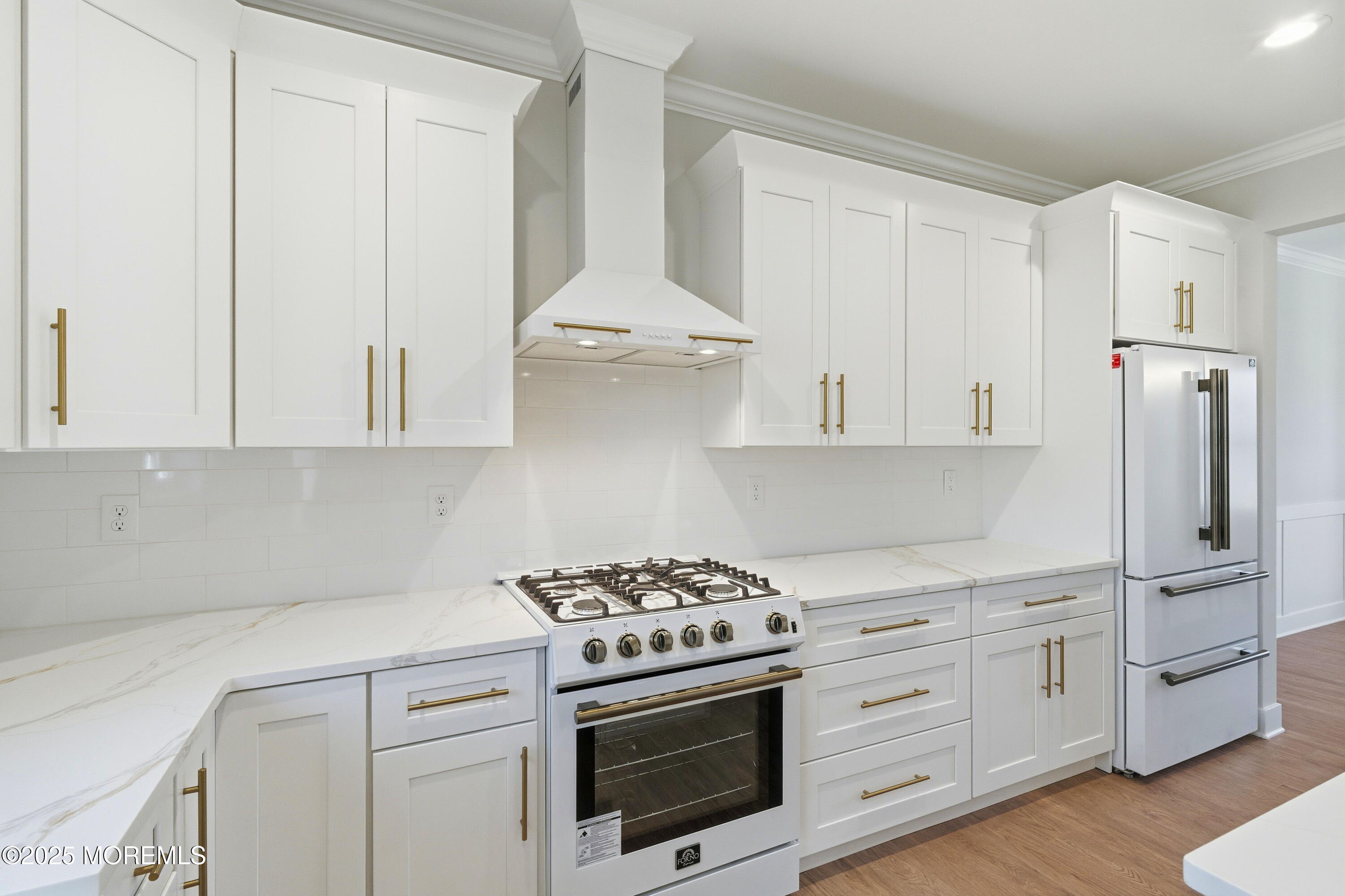 421 Roland Avenue Bayville, NJ 08721 - Photo 18 of 45 a kitchen with stainless steel appliances white cabinets and a stove