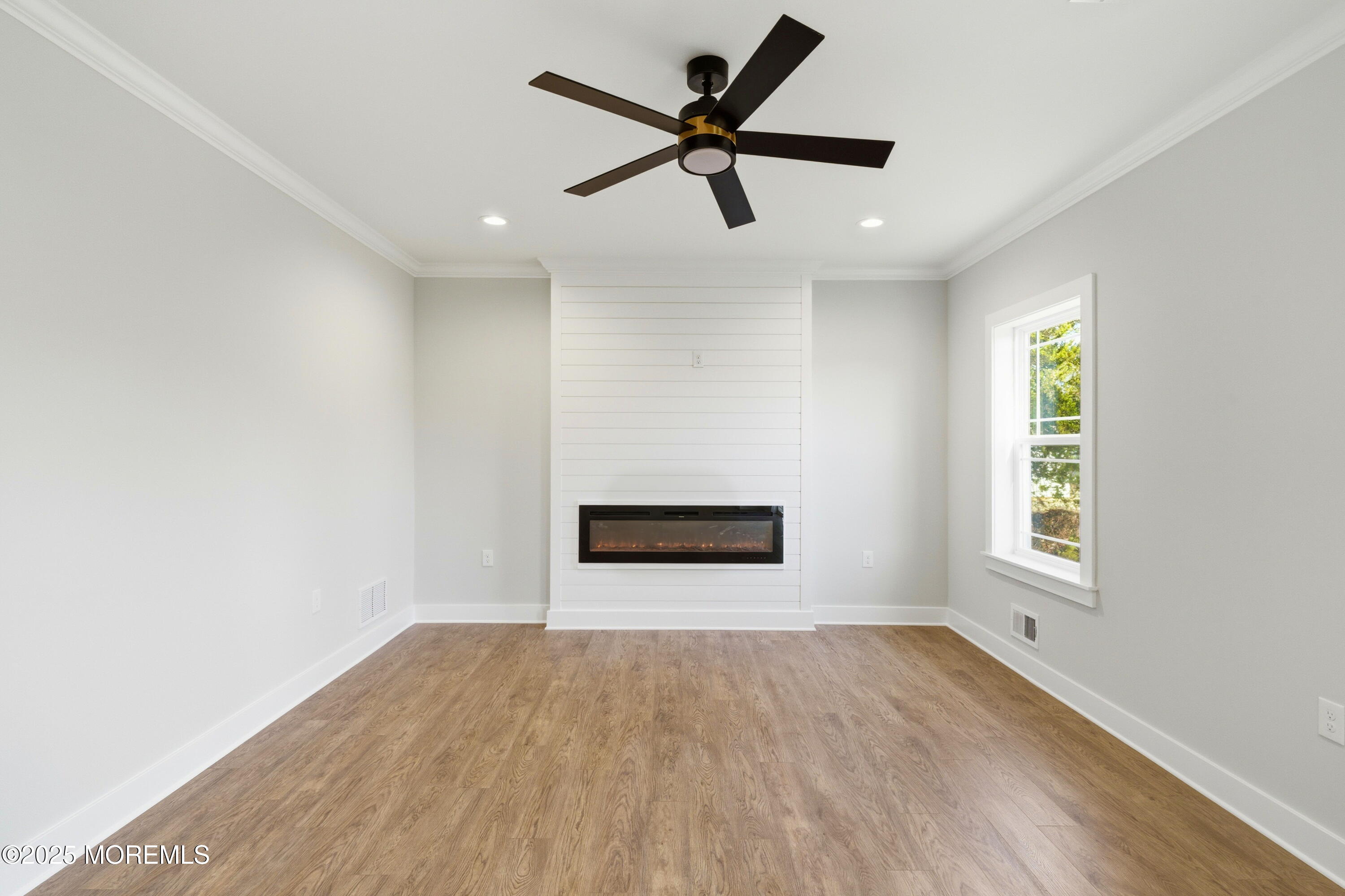 421 Roland Avenue Bayville, NJ 08721 - Photo 20 of 45 wooden floor in an empty room with a window