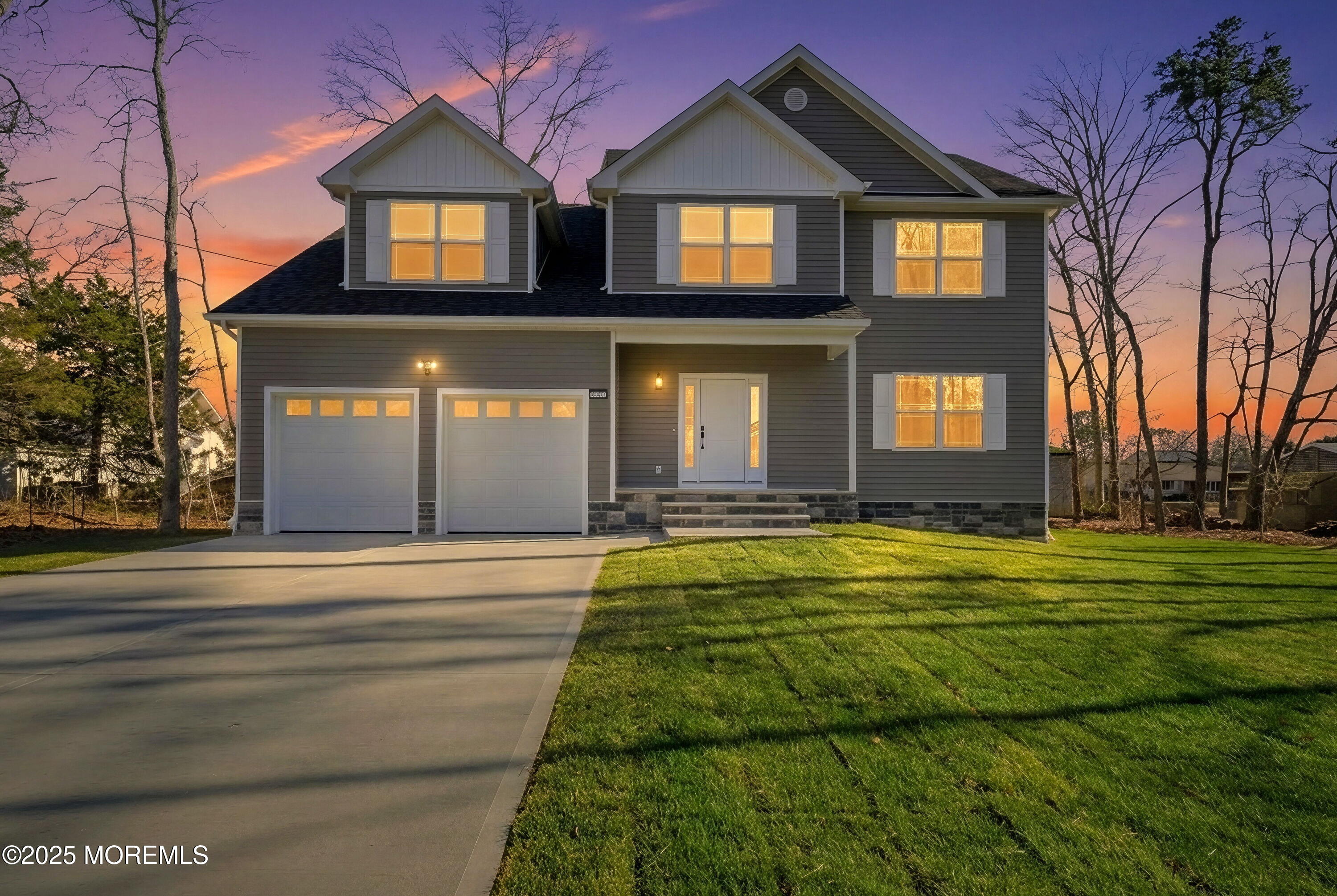 421 Roland Avenue Bayville, NJ 08721 - Photo 2 of 45 a front view of a house with a yard