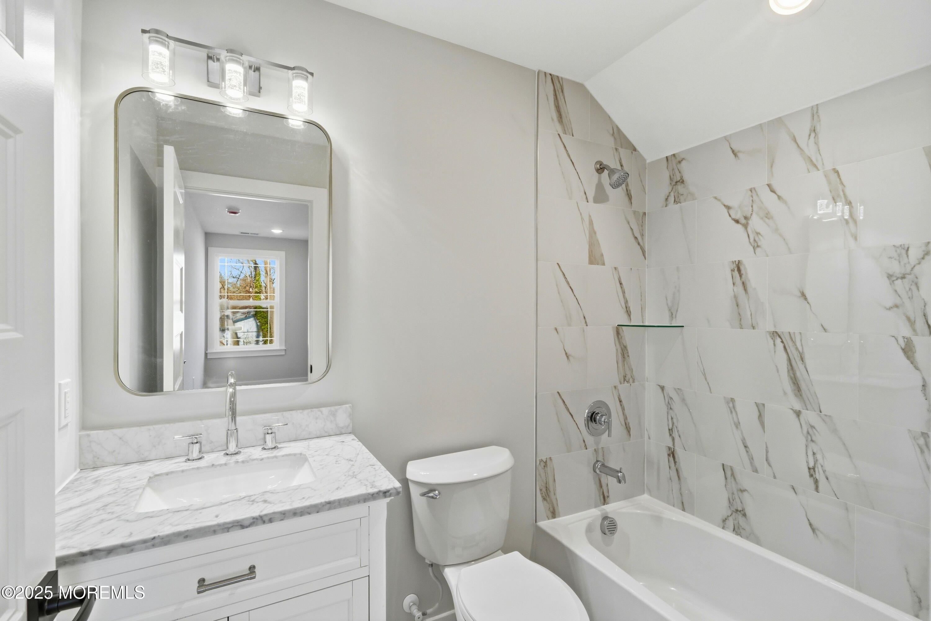 421 Roland Avenue Bayville, NJ 08721 - Photo 27 of 45 a bathroom with a granite countertop sink toilet a mirror and shower