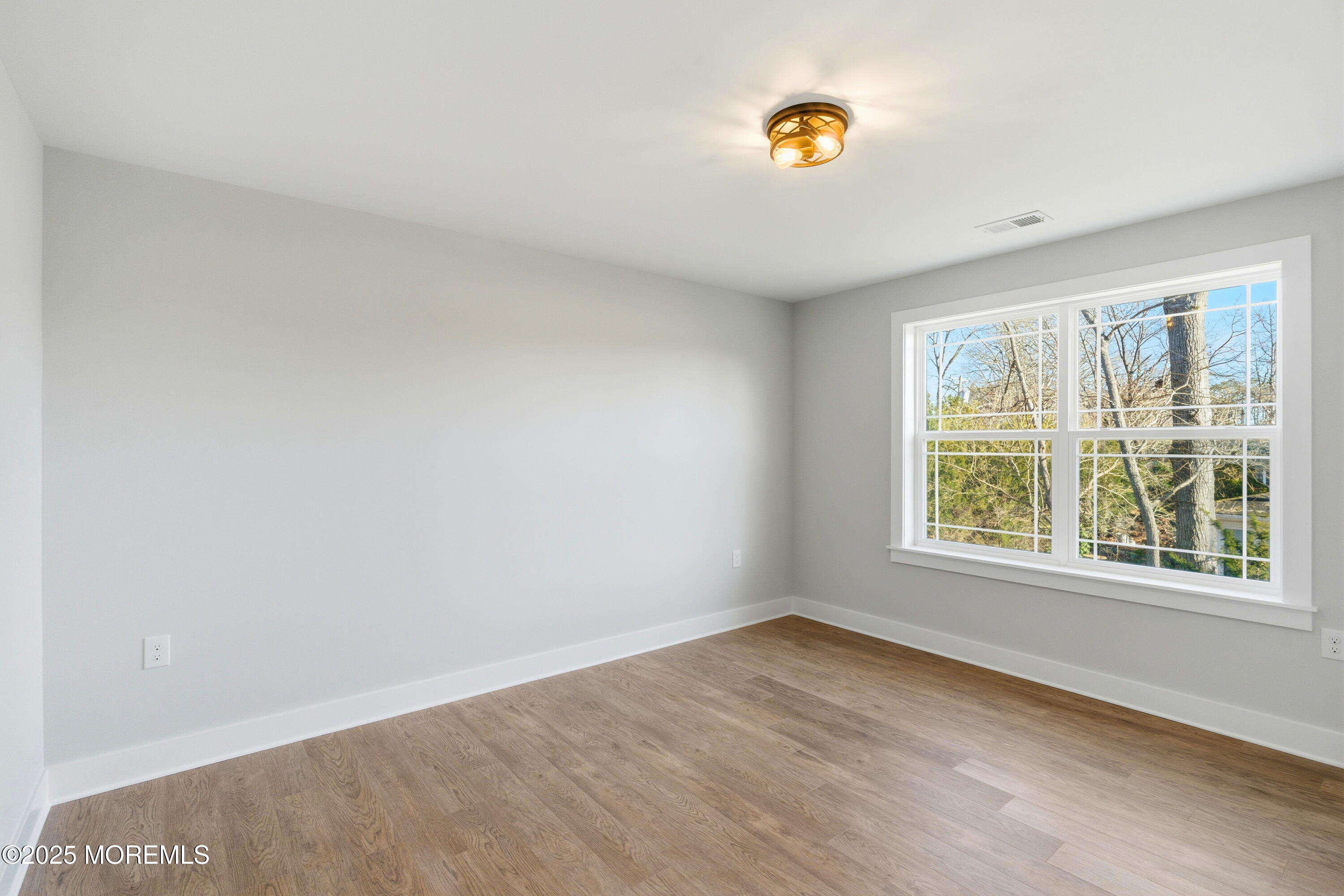 421 Roland Avenue Bayville, NJ 08721 - Photo 28 of 45 an empty room with a window