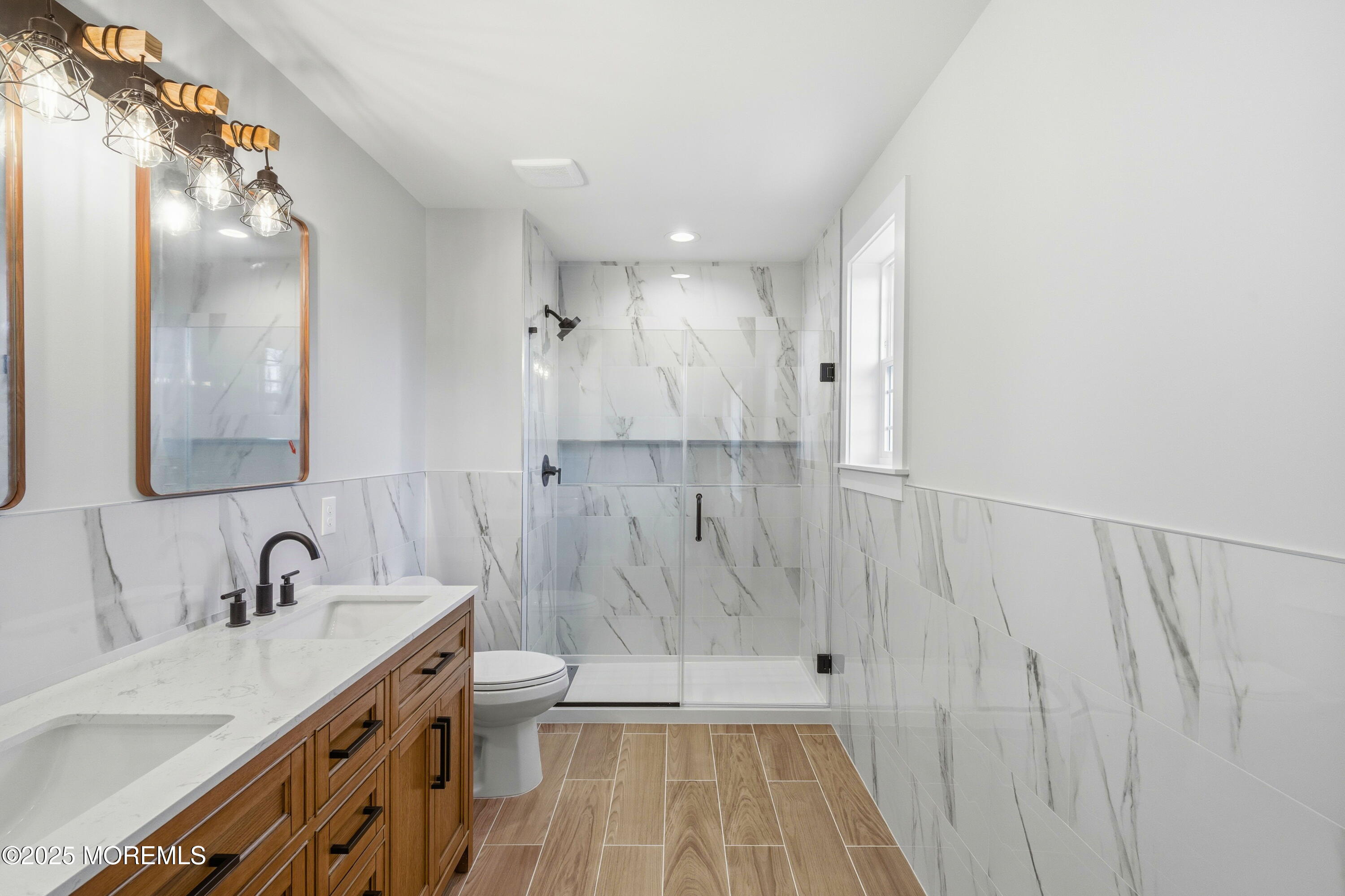 421 Roland Avenue Bayville, NJ 08721 - Photo 38 of 45 a bathroom with a sink a toilet and shower