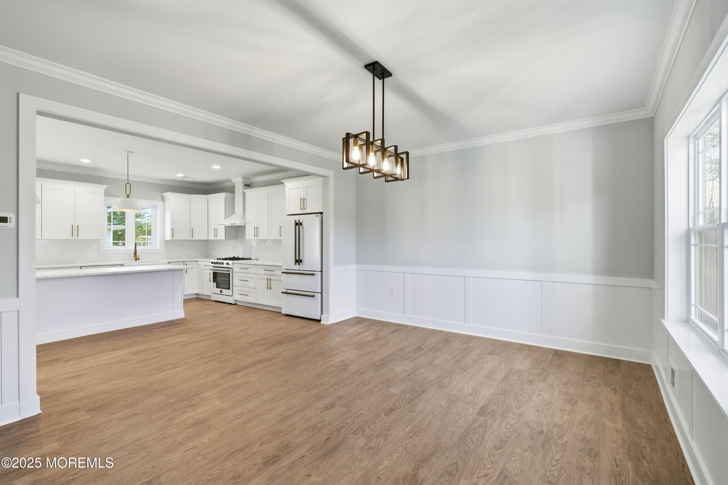421 Roland Avenue Bayville, NJ 08721 - Photo 9 of 45 a view of a kitchen with wooden floor and a window