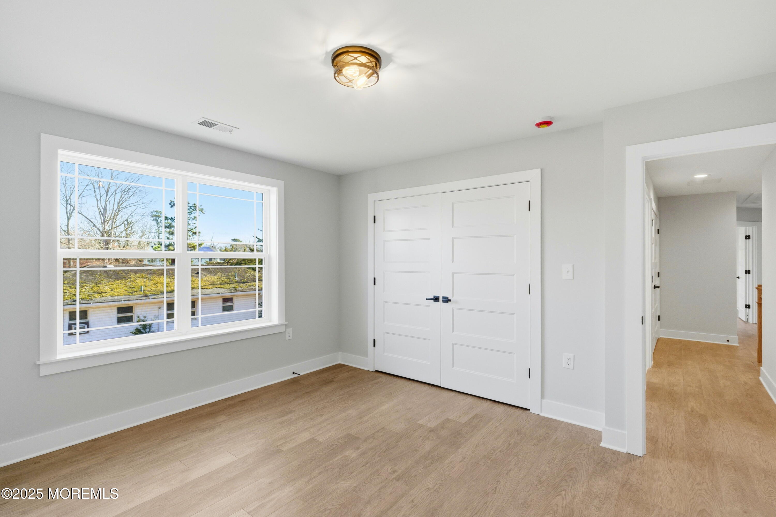 421 Roland Avenue Bayville, NJ 08721 - Photo 10 of 45 a view of an empty room with a window