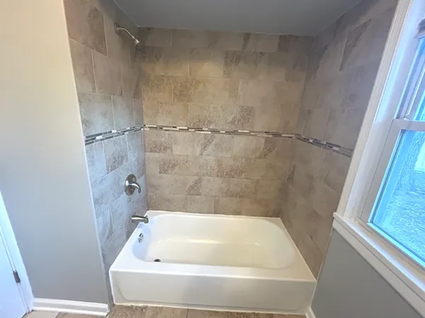 a bathroom with a bathtub