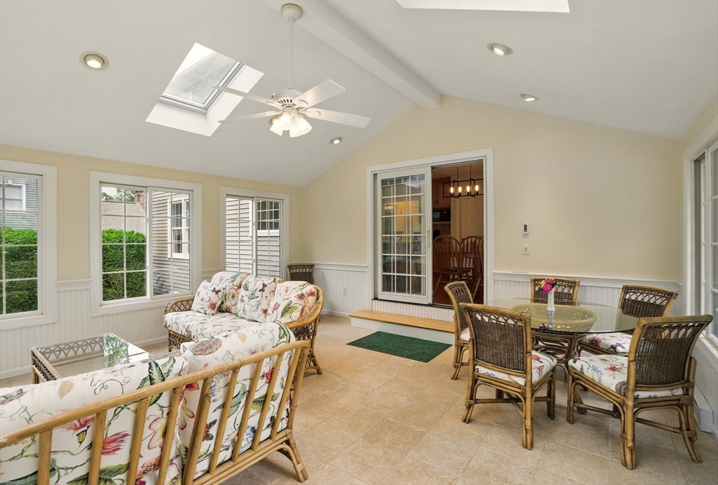 36 Buehler Road Bedford, MA 01730 - Photo 13 of 40 a living room with furniture and large windows