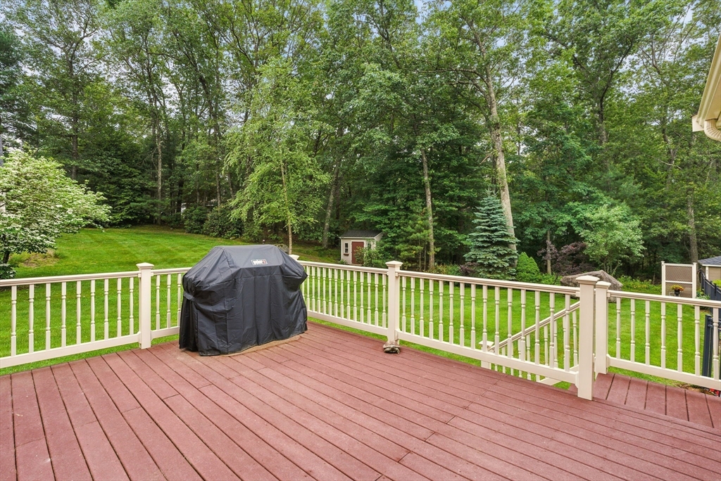 36 Buehler Road Bedford, MA 01730 - Photo 14 of 40 a view of a deck with two chairs and wooden fence