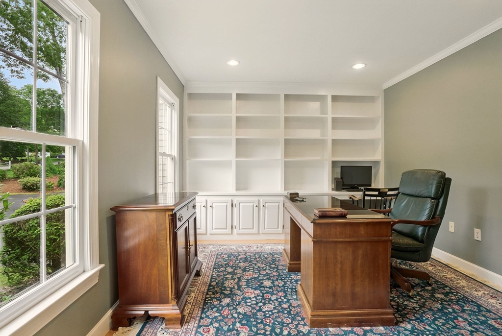36 Buehler Road Bedford, MA 01730 - Photo 17 of 40 a view of a workspace with furniture and a window