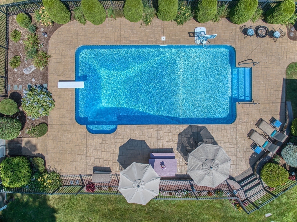 36 Buehler Road Bedford, MA 01730 - Photo 2 of 40 an aerial view of a house with table and chairs