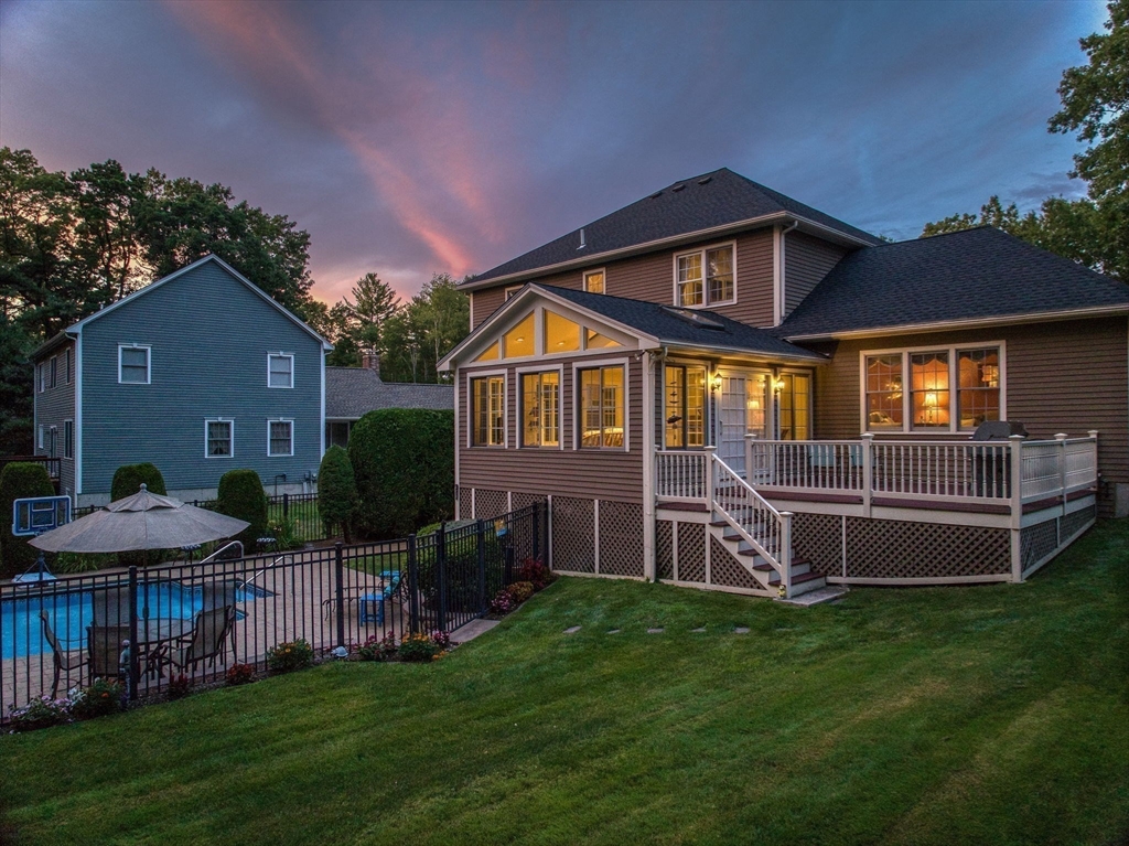 36 Buehler Road Bedford, MA 01730 - Photo 27 of 40 a front view of a house with a garden and yard