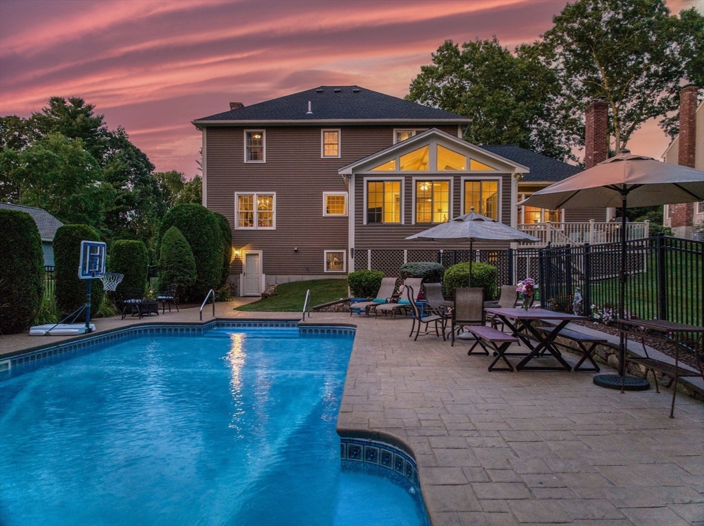 36 Buehler Road Bedford, MA 01730 - Photo 28 of 40 a view of a house with patio and garden