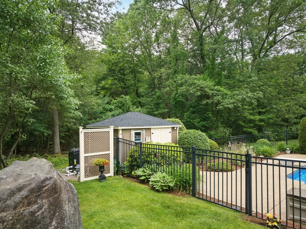 36 Buehler Road Bedford, MA 01730 - Photo 30 of 40 a front view of a house with a yard