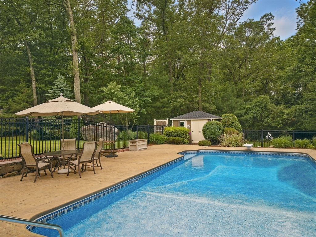 36 Buehler Road Bedford, MA 01730 - Photo 3 of 40 an outdoor space with patio and white umbrellas