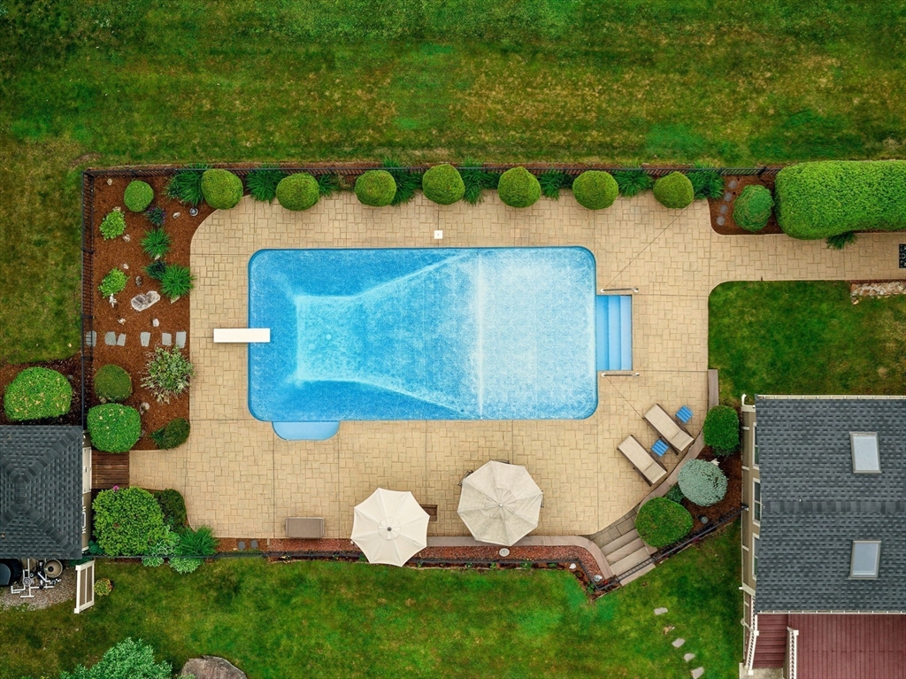 36 Buehler Road Bedford, MA 01730 - Photo 31 of 40 a view of a table in a backyard