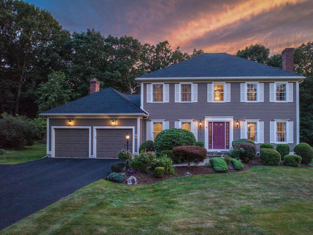 36 Buehler Road Bedford, MA 01730 - Photo 33 of 40 a front view of a house with a yard and garage