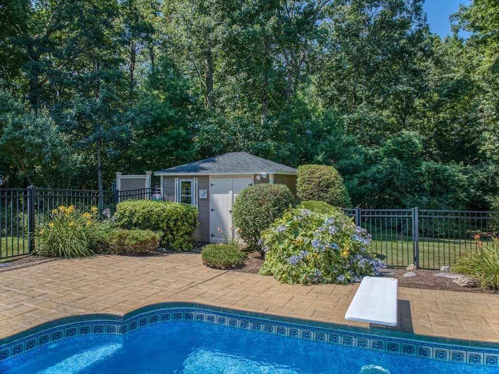 36 Buehler Road Bedford, MA 01730 - Photo 36 of 40 a front view of a house with a yard