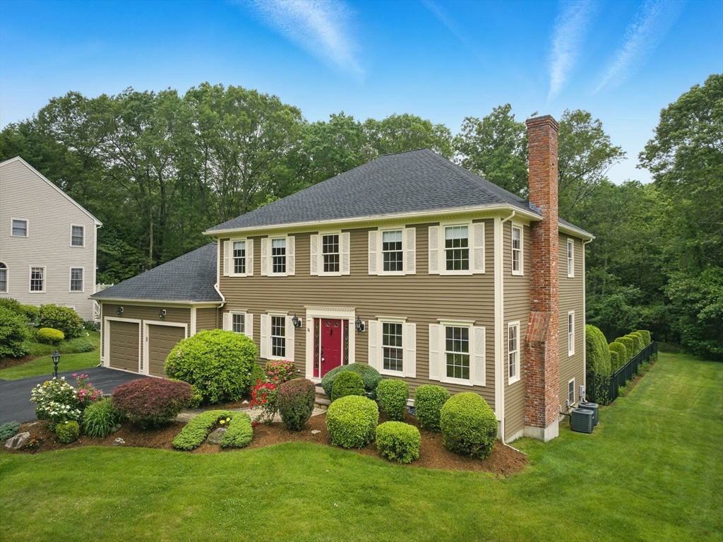 36 Buehler Road Bedford, MA 01730 - Photo 38 of 40 a front view of a house with garden and plants