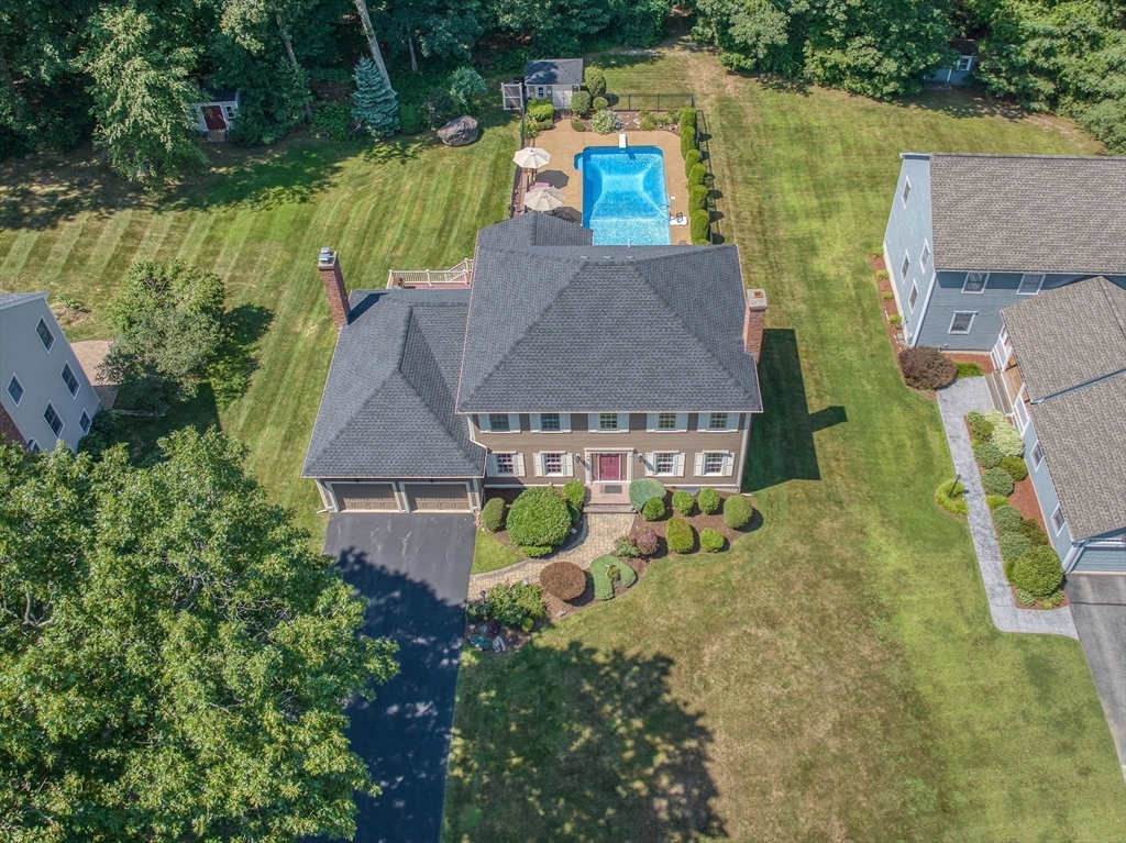 36 Buehler Road Bedford, MA 01730 - Photo 39 of 40 an aerial view of a house with a garden and lake view