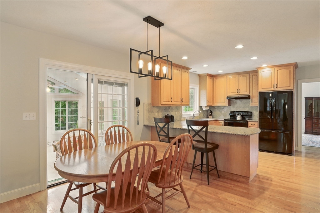 36 Buehler Road Bedford, MA 01730 - Photo 7 of 40 a view of a dining room with furniture window and wooden floor