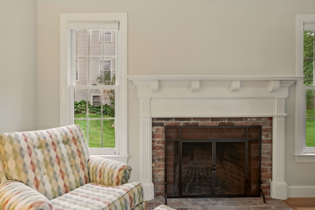 36 Buehler Road Bedford, MA 01730 - Photo 10 of 40 a living room with furniture and a fireplace