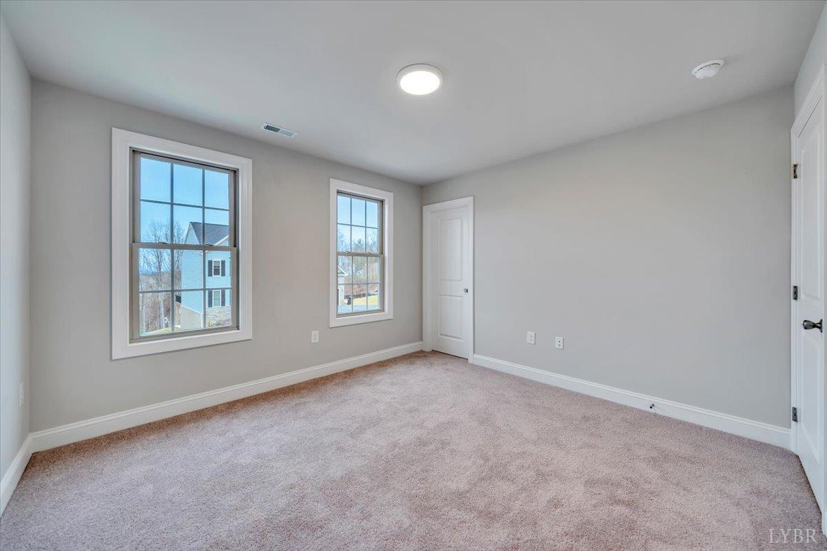 55 Carriage Parkway Rustburg, VA 24588 - Photo 21 of 25 an empty room with windows & closet
