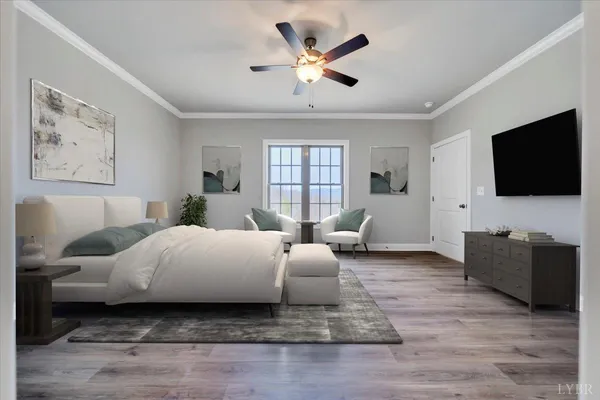 a spacious bedroom with a bed couch and a flat screen tv