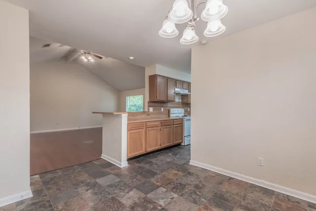 a view of a kitchen with a sink and dishwasher