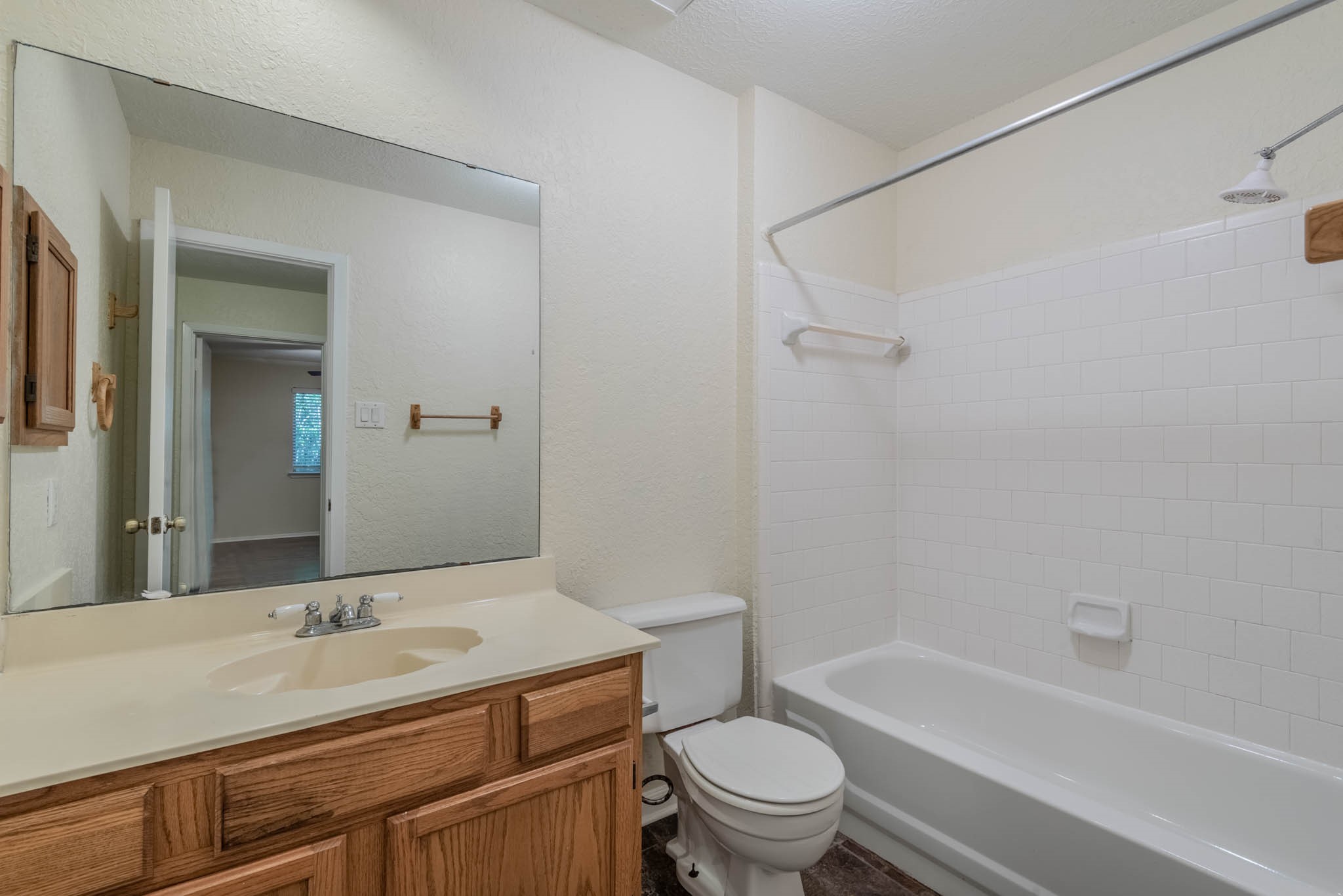 4922 Temple Bell Drive Spring, TX 77388 - Photo 18 of 21 a bathroom with a granite countertop sink a toilet and shower