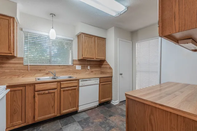 a kitchen that has a sink and a window