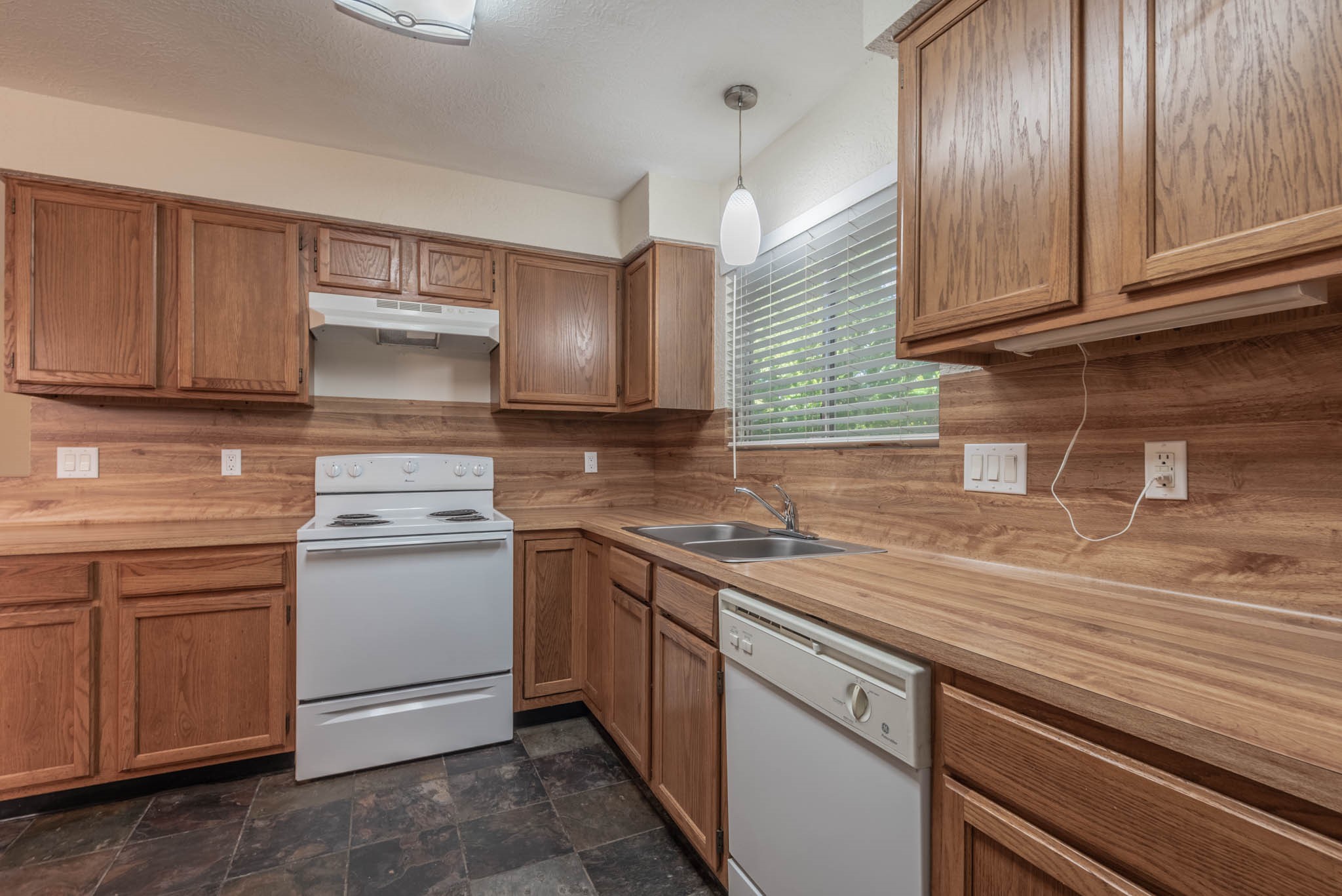 4922 Temple Bell Drive Spring, TX 77388 - Photo 9 of 21 a kitchen with a sink and cabinets