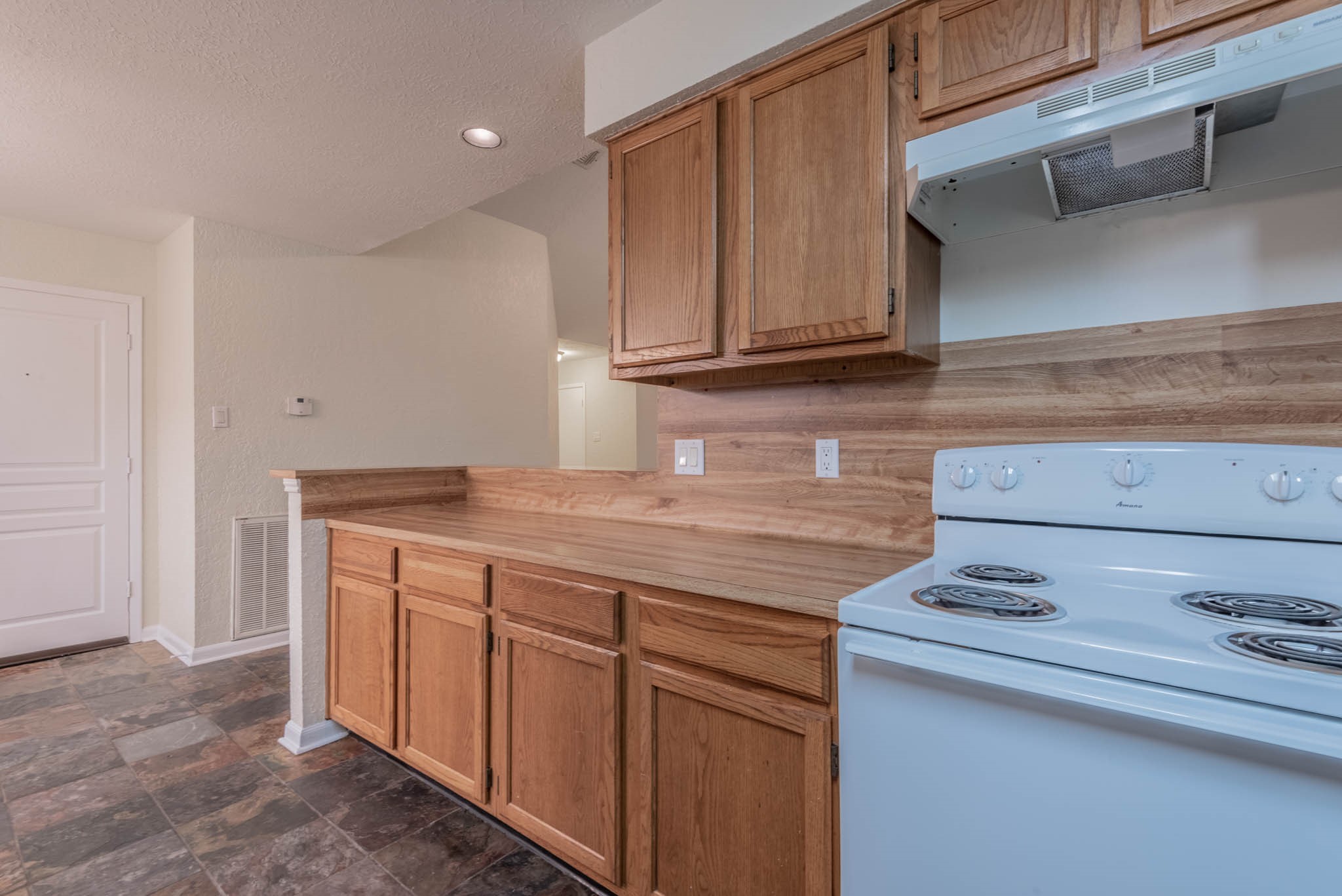 4922 Temple Bell Drive Spring, TX 77388 - Photo 10 of 21 a kitchen with granite countertop wood cabinets and a sink