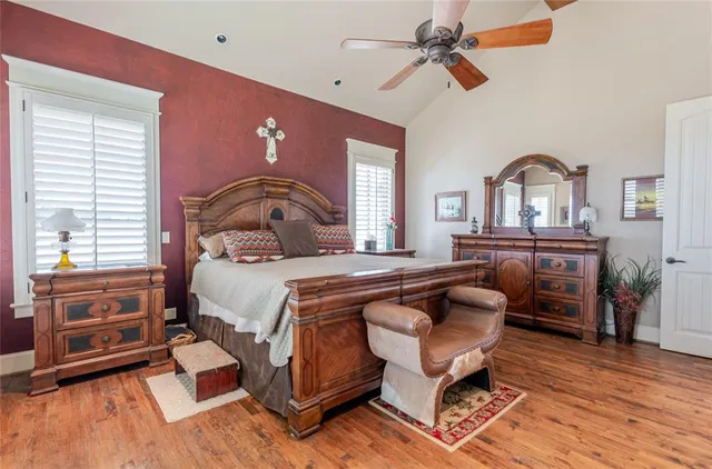 a bedroom with a bed and wooden furniture