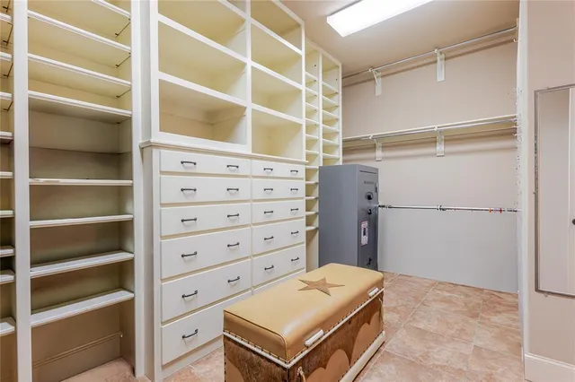 a view of an empty walk in closet