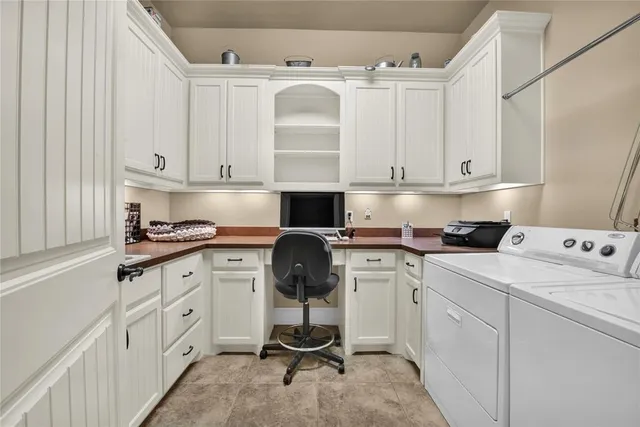 a kitchen with cabinets appliances and a counter top