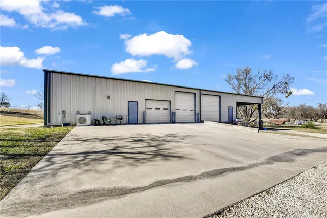 a view of an house with backyard space and balcony