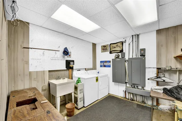 a room with furniture a washer and dryer