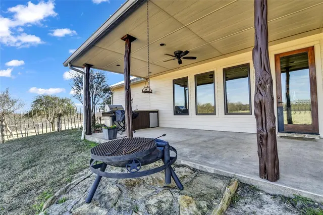 a patio with table and chairs