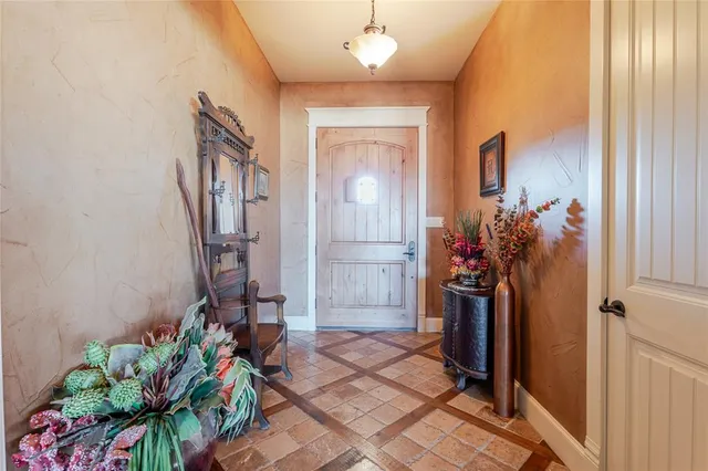 a view of a entryway with flower pots