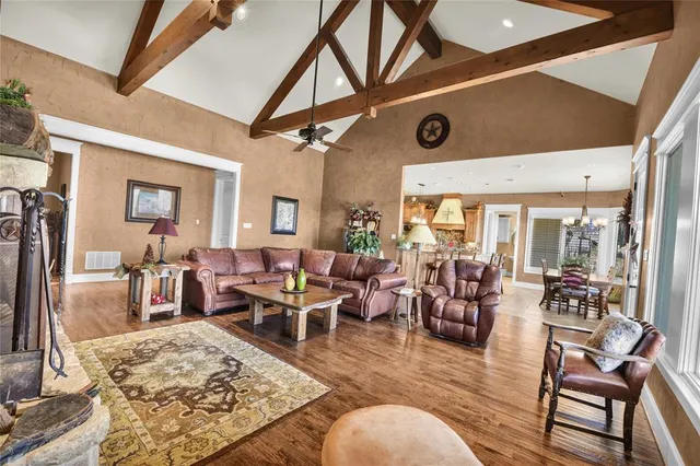 a very nice looking living room with furniture and a large window