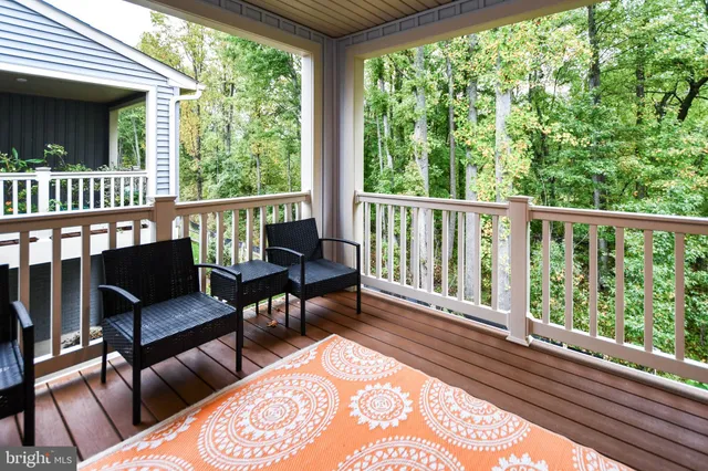 a view of a two chairs in the balcony